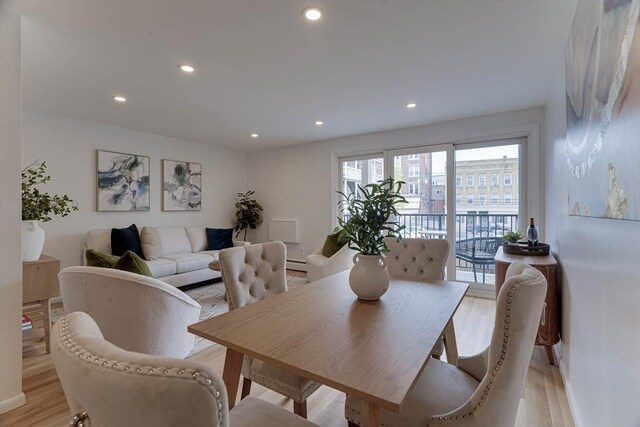 dining space featuring recessed lighting and light wood-style flooring