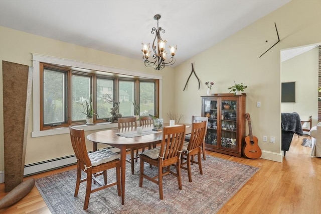 6 Lous Dr, Dudley, MA 01571 - dining room featuring a chandelier, light wood-style flooring, and vaulted ceiling