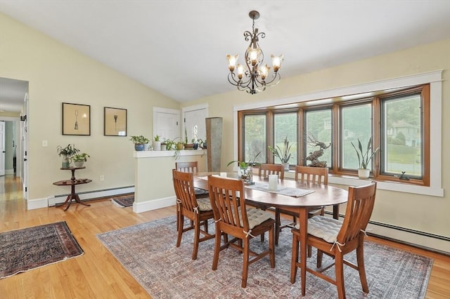 6 Lous Dr, Dudley, MA 01571 - dining area with a baseboard heating unit, a chandelier, light wood-style flooring, vaulted ceiling, and baseboard heating