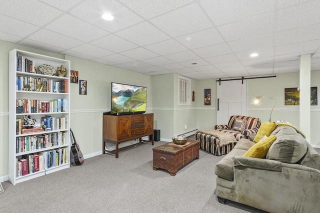 6 Lous Dr, Dudley, MA 01571 - carpeted living room with a baseboard heating unit, a barn door, a paneled ceiling, and recessed lighting