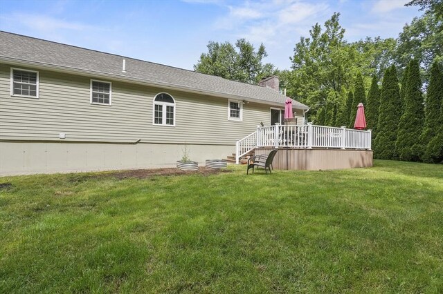 6 Lous Dr, Dudley, MA 01571 - rear view of property featuring a wooden deck, a lawn, and a chimney