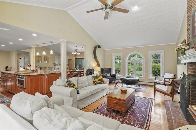6 Lous Dr, Dudley, MA 01571 - living room with wood finished floors, lofted ceiling, a ceiling fan, a chandelier, and a fireplace