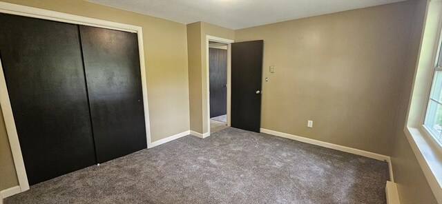 1 Wysocki Dr Unit 9, Dudley, MA 01571 - unfurnished bedroom with carpet floors, a closet, and baseboards