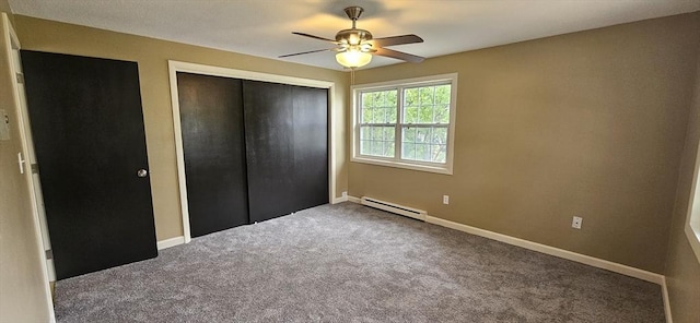 1 Wysocki Dr Unit 9, Dudley, MA 01571 - unfurnished bedroom with a baseboard radiator, carpet floors, a closet, baseboards, and a ceiling fan