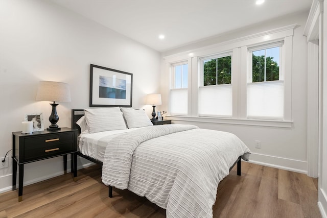 bedroom with hardwood / wood-style floors