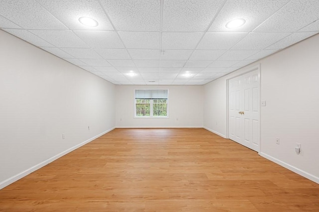 empty room with light wood-style flooring, baseboards, and recessed lighting
