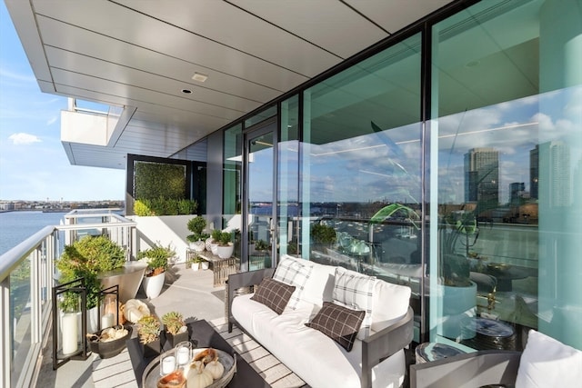 balcony featuring a water view