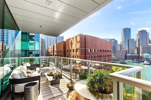 balcony featuring a water view