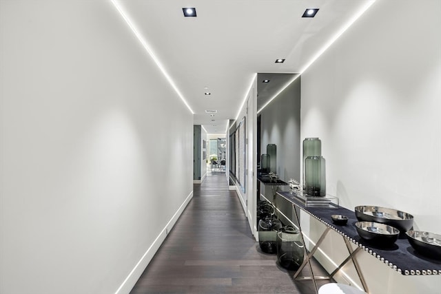 hallway featuring dark hardwood / wood-style floors