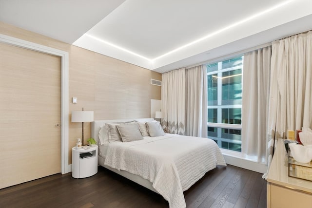 bedroom featuring dark hardwood / wood-style flooring