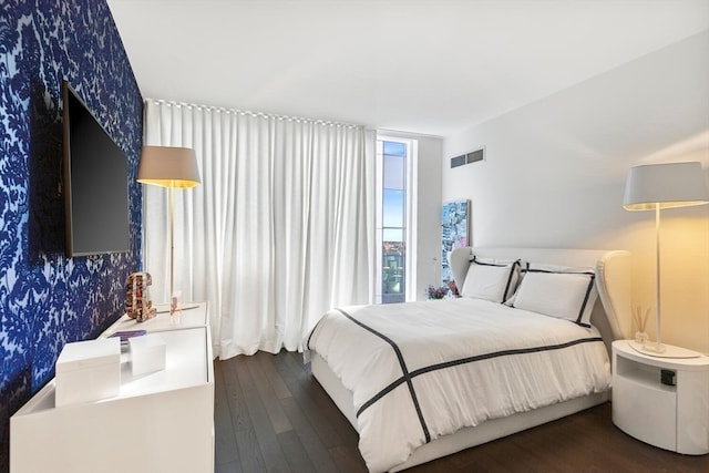 bedroom featuring dark hardwood / wood-style floors