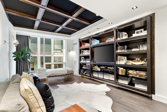 living room featuring hardwood / wood-style floors, coffered ceiling, and beam ceiling