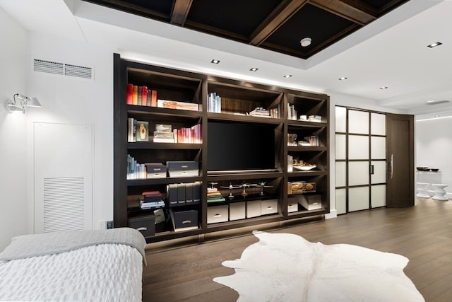 interior space featuring beamed ceiling and hardwood / wood-style flooring