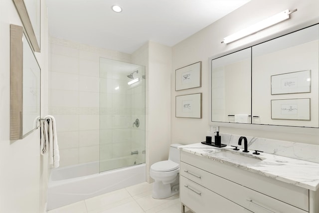 full bathroom with shower / bath combination with glass door, vanity, toilet, and tile patterned floors