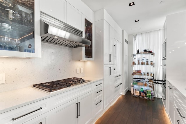 kitchen featuring ventilation hood, white cabinetry, and dark hardwood / wood-style flooring