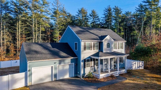 view of front of home featuring a porch and a garage