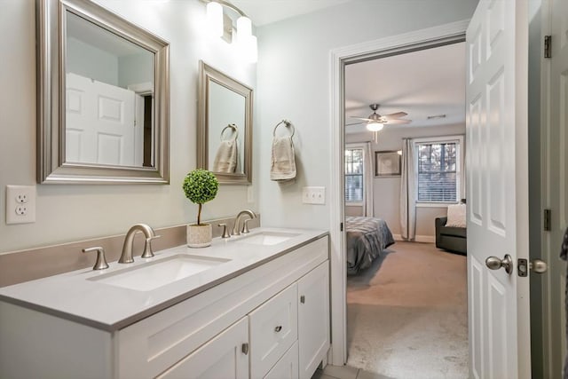 bathroom featuring ceiling fan and vanity