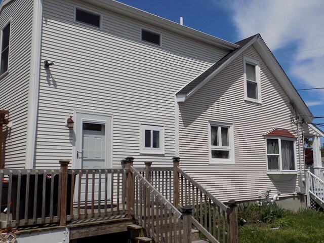 back of property with a deck