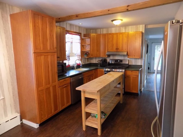 kitchen featuring appliances with stainless steel finishes, a baseboard heating unit, under cabinet range hood, open shelves, and dark countertops