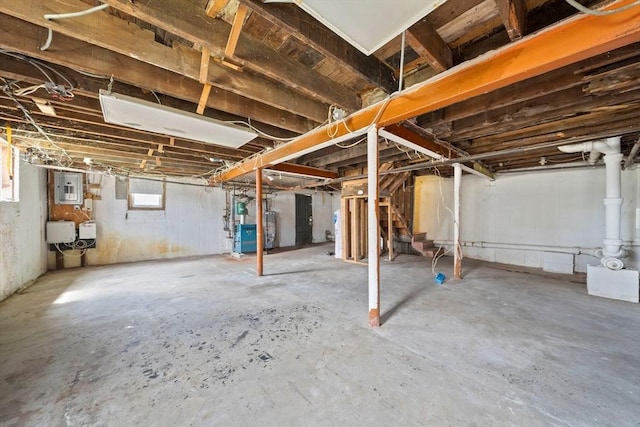 basement featuring electric panel and stairs