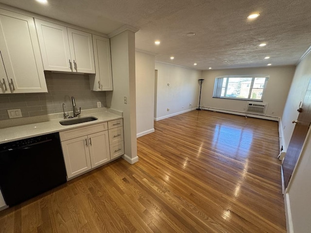 kitchen featuring sink, light hardwood / wood-style floors, white cabinets, and dishwasher