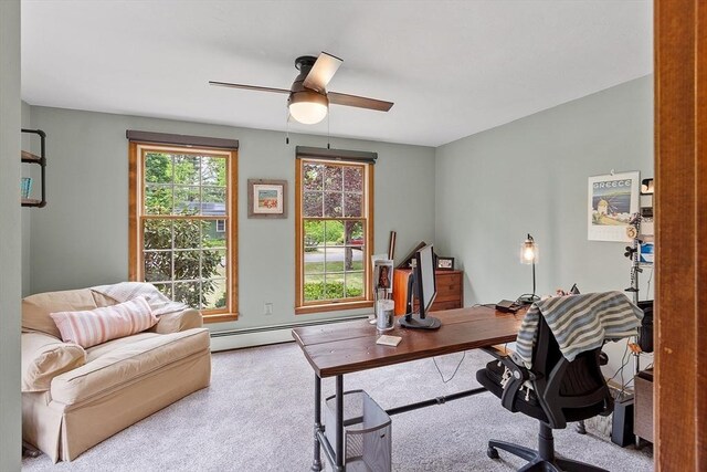carpeted home office featuring baseboard heating and ceiling fan