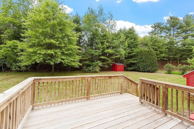 wooden terrace featuring a lawn