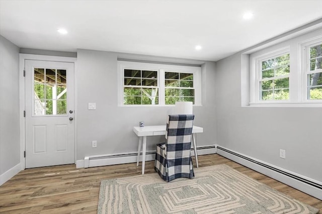 office with baseboard heating, wood finished floors, recessed lighting, and baseboards