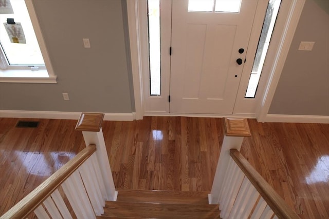 6 Lovis Ave, Wakefield, MA 01880 - entryway with baseboards, wood finished floors, and visible vents