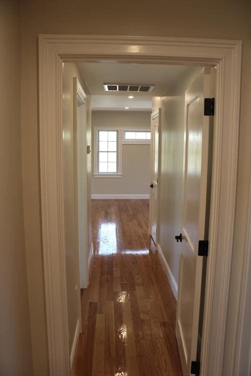 6 Lovis Ave, Wakefield, MA 01880 - hallway with wood finished floors, visible vents, and baseboards