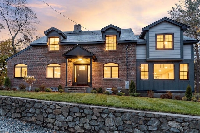 6 Lovis Ave, Wakefield, MA 01880 - view of front of house featuring brick siding, a front lawn, and a chimney