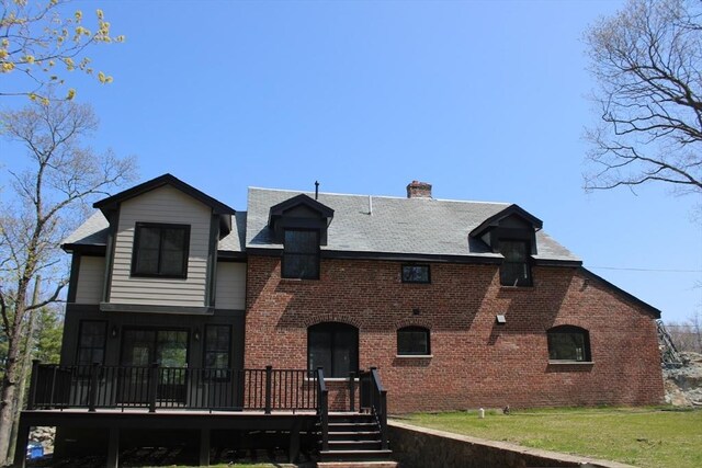 6 Lovis Ave, Wakefield, MA 01880 - view of front of home with a chimney, a front lawn, a deck, a shingled roof, and brick siding