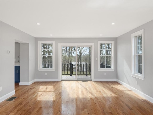 6 Lovis Ave, Wakefield, MA 01880 - interior space featuring recessed lighting, visible vents, baseboards, and light wood-type flooring