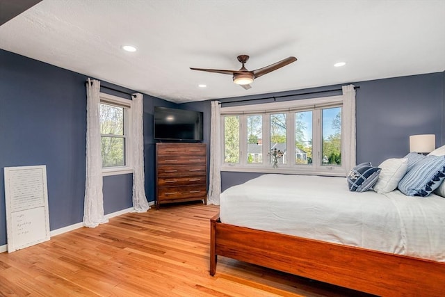 bedroom featuring baseboards, ceiling fan, recessed lighting, and light wood-style flooring