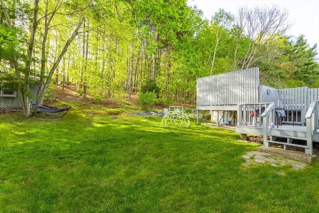 view of yard with a wooden deck