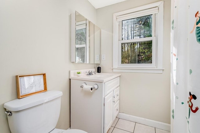 full bathroom featuring tile patterned flooring, a healthy amount of sunlight, toilet, and vanity