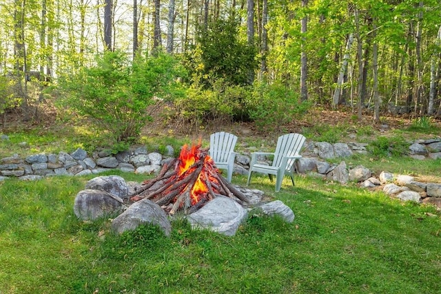 exterior space featuring an outdoor fire pit