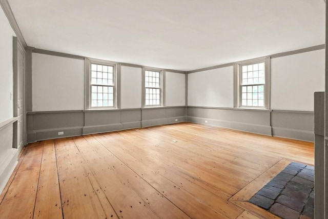 empty room with light hardwood / wood-style floors