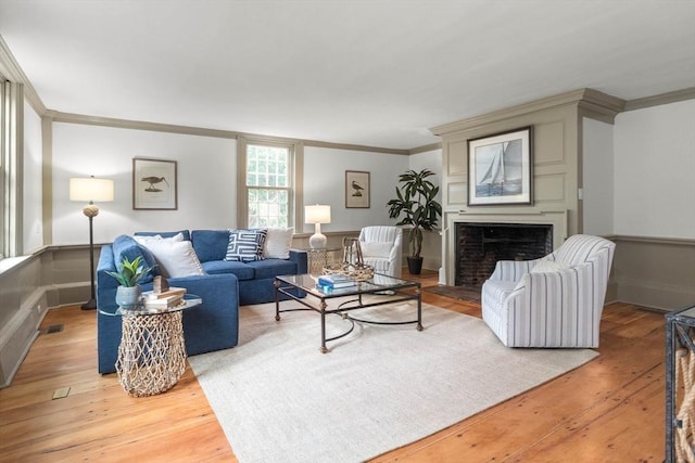 living room featuring hardwood / wood-style floors and ornamental molding