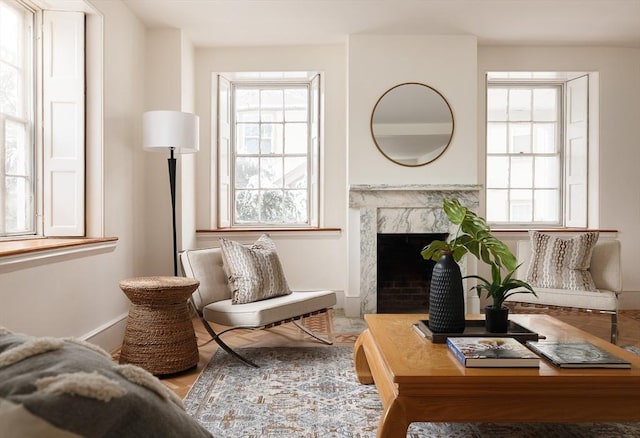 sitting room featuring a high end fireplace