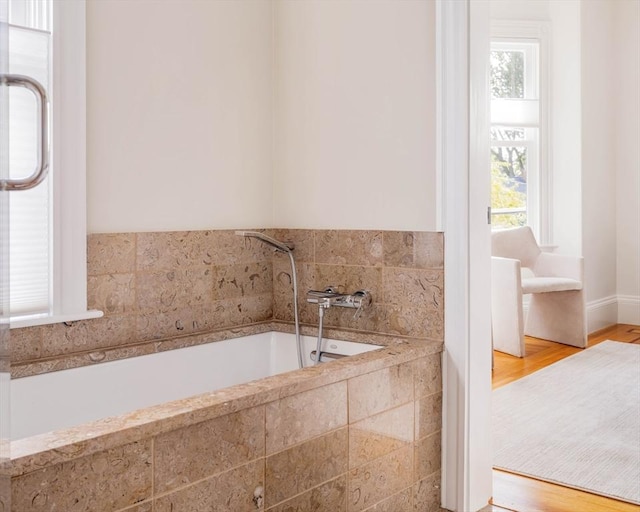 bathroom with a garden tub