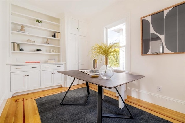 office featuring light wood-style floors and baseboards