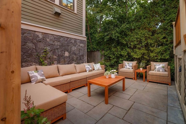 view of patio / terrace with outdoor lounge area and fence