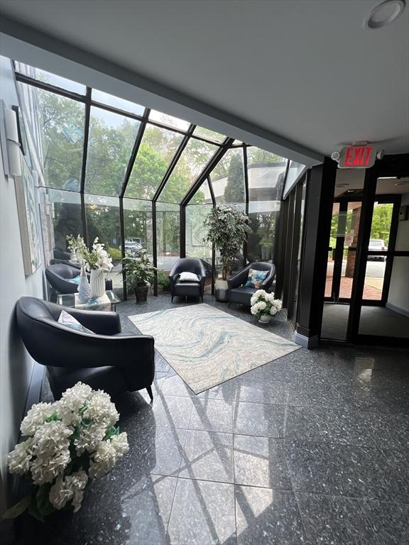 9 Broadway Unit 210, Saugus, MA 01906 - common area with a sunroom and expansive windows