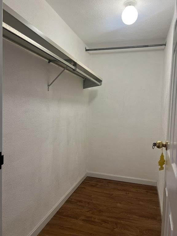 9 Broadway Unit 210, Saugus, MA 01906 - walk in closet with dark wood-style flooring