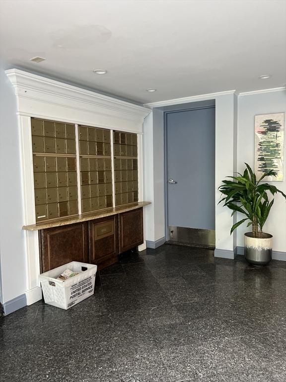 9 Broadway Unit 210, Saugus, MA 01906 - spare room featuring baseboards and ornamental molding