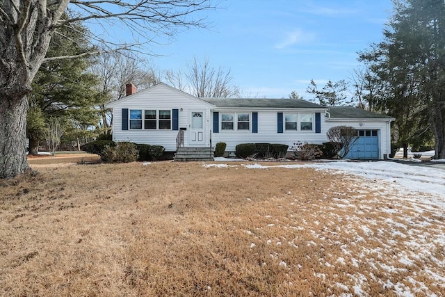 single story home with a garage and a lawn