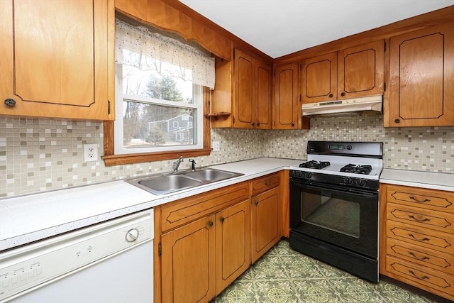 kitchen featuring sink, gas range, dishwasher, and backsplash