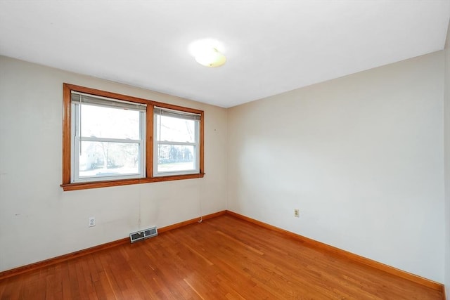 unfurnished room featuring wood-type flooring