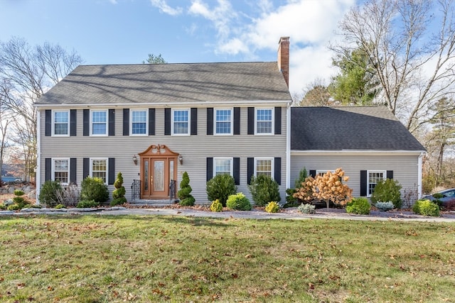 colonial-style house with a front lawn